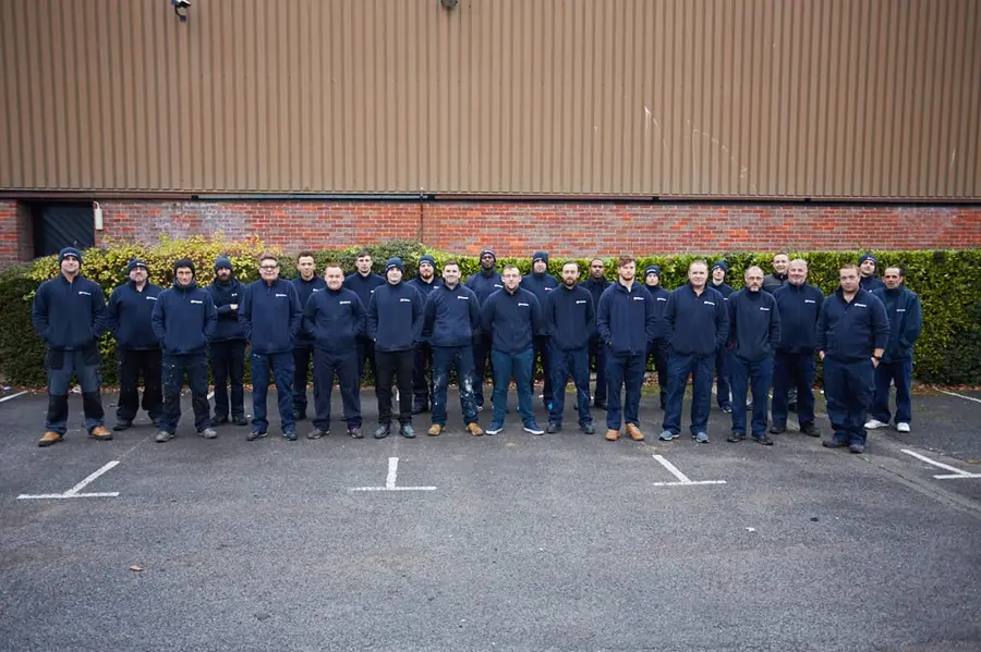 JG Pest Control's London and South East technicians lined up in a car park outside a JG building
